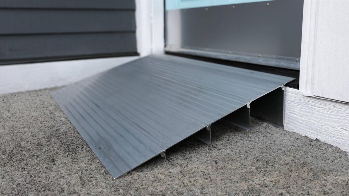 Low-rise threshold ramp smoothing the transition at a doorway